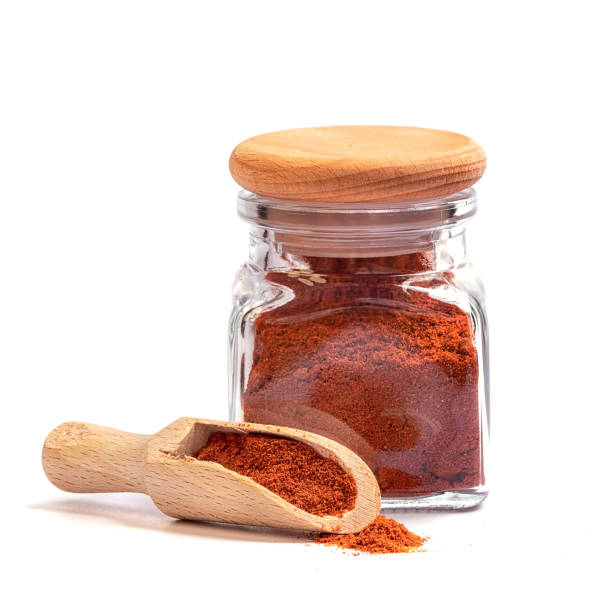 heap of sweet pepper powder on a white background heap of sweet pepper powder on a white background cayenne pepper stock pictures, royalty-free photos & images