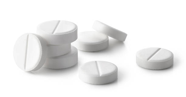 hoop van witte ronde pillen of tabletten - pijnstiller stockfoto's en -beelden