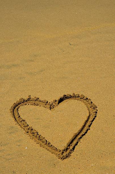 Heart Alone In Sand stock photo