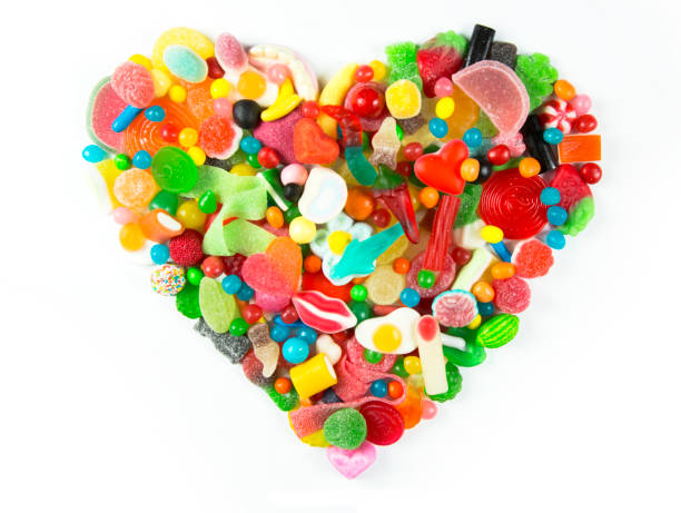 heart made from sweets a large collection of sweets and candy made into a heart shape pick and mix stock pictures, royalty-free photos & images