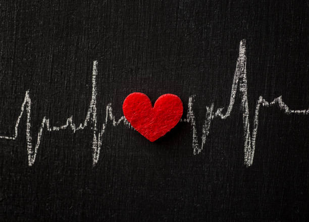 Heart rhythm and Heart on chalkboard Heart Shape, Heart health, Heart rhythm taking pulse stock pictures, royalty-free photos & images