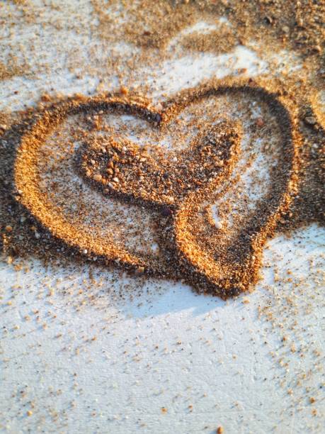 Heart shaped sand stock photo