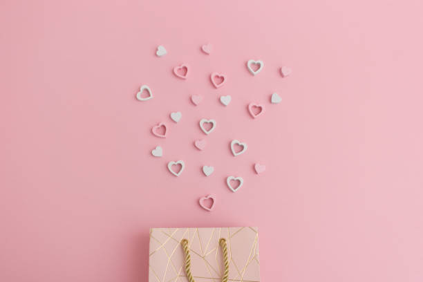 Hearts flying out of a valentines gift bag stock photo