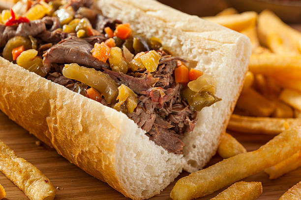 Hearty Italian Beef Sandwich Hearty Italian Beef Sandwich with Hot Giadanarra Peppers italian culture stock pictures, royalty-free photos & images