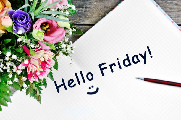 Hello friday words on notebook page stock photo
