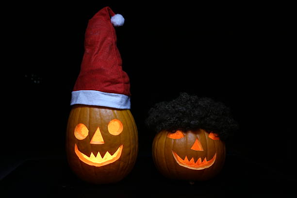 Helloween pumpkin couple Santa Claus stock photo