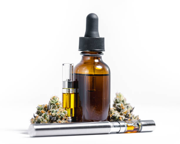 Hemp Oil Vial and Vape Pen with CBD Marijuana for Treatment or Recreation Macro display of medical cannabis products on white background with vaporizer and glass jar for drops marijuana herbal cannabis photos stock pictures, royalty-free photos & images