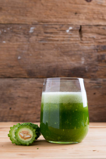Herbal juice of green momodica , Balsam apple, Balsam pear, Bitter cucumber , Bitter gourd stock photo