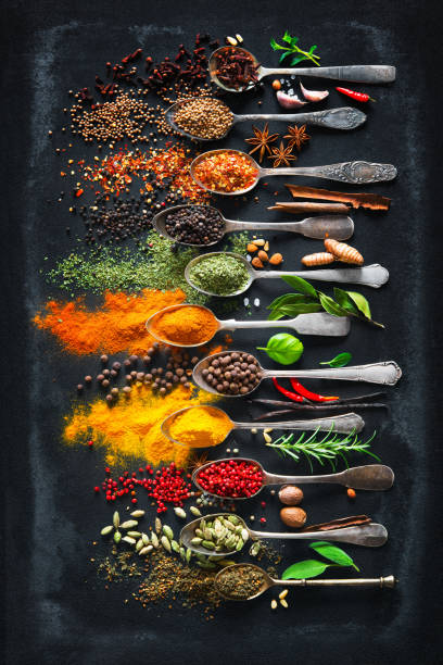 Herbs and spices for cooking on dark background Colourful various herbs and spices for cooking on dark background chalkboard visual aid photos stock pictures, royalty-free photos & images