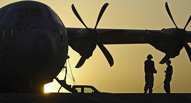 RAF C-130 Hercules taxis across desert Helmand Province, Afghanistan RAF C-130 Hercules taxis across desert Helmand Province, Afghanistan afghanistan stock pictures, royalty-free photos & images
