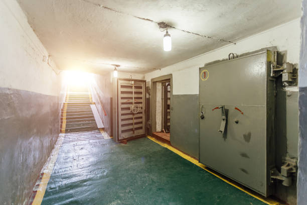Hermetic metal armored doors with valves in  the entrance of soviet bomb shelter protective construction of civil defense stock photo