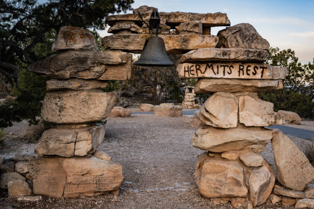 Hermits Rest Sign and Bell On Stacked Stone Arch stock photo