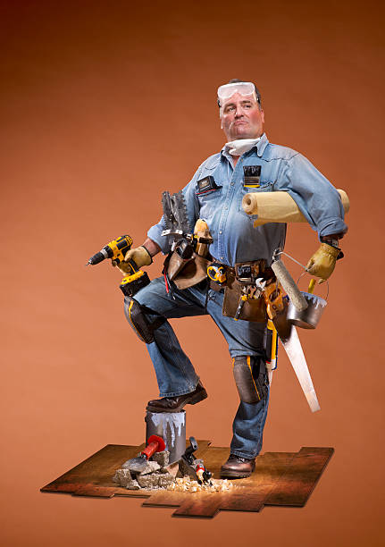 DIY Hero Mature man with all the gear ,  DIY have a go hero . tool belt stock pictures, royalty-free photos & images