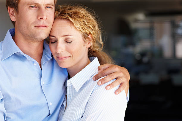 he's always there to support her - embrace man woman serious stockfoto's en -beelden