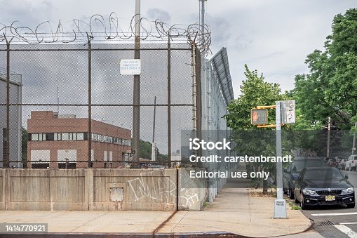 High and strong fence with barbed wire on top