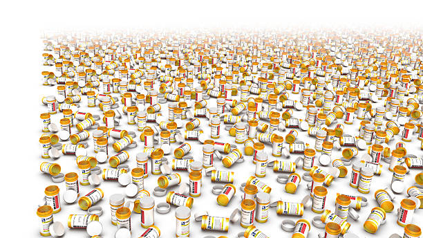 High Angle View of Empty PIll Bottles Left Side Border High Angle View of Empty Pill Bottles with left side blank space for text xanax pills stock pictures, royalty-free photos & images