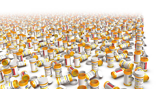 High angle view of empty pill bottles (Right Blank) High angle view of empty pill bottles with a right blank area if you want to add text. xanax pills stock pictures, royalty-free photos & images
