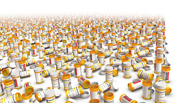 High Angle View of Empty Pill Bottles Right Side Border High Angle View of Empty Pill Bottles with right side blank space for text xanax pills stock pictures, royalty-free photos & images
