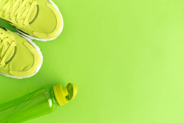 High angle view of trainers and bottle stock photo