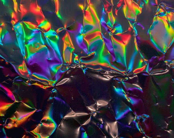 высокое res макро фото абстрактной пастельные радужные голографические фольги фон с утечками света. - holographic foil стоковые фото и изображения