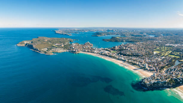 High resolution panoramic high angle drone view of Manly Beach, North Head and the Sydney Harbour area. Manly is a popular suburb of Sydney, New South Wales, Australia. Famous tourist destination. stock photo
