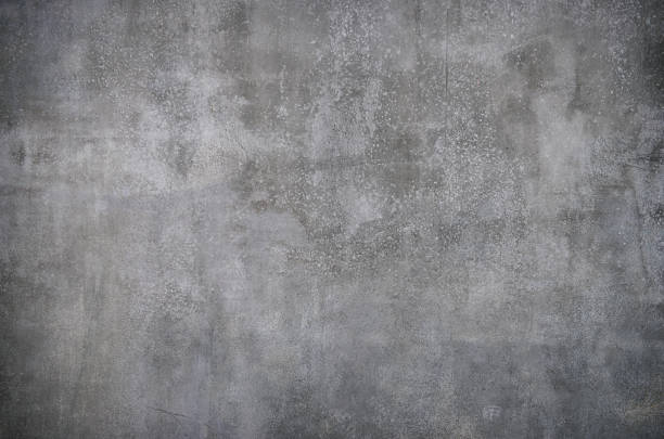 High resolution photograph of a grey concrete wall Concrete wall background, slight vignette. (XXXL-File) concrete wall stock pictures, royalty-free photos & images