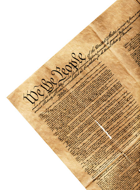 high resolution scan of we the people preamble isolated white high resolution scan of the preamble of the United States. This is the first page with the famous line of We The People. This is an old replica of this historical document. It is creased and ripped. The white background is isolated from the document. declaration of independence stock pictures, royalty-free photos & images