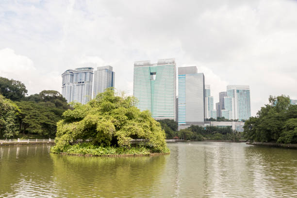High rise panorama Perdana Botanical Gardens Lake Gardens in Kuala Lumpur. In the background a high rise panorama Perdana Botanical Gardens Lake Gardens in Kuala Lumpur, Malaysia. perdana botanical garden stock pictures, royalty-free photos & images