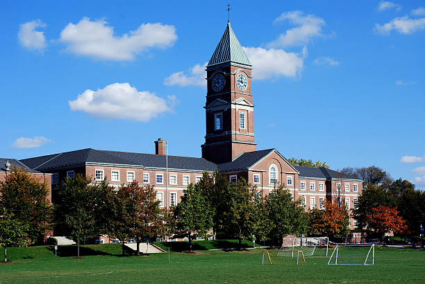 High school with soccer field An old fashioned high school building with a clock tower.  It's Upper Canada College, an "elite" private school in Toronto. high school building stock pictures, royalty-free photos & images