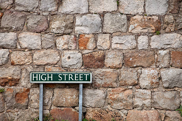 High Street Sign and Stone Wall, Avebury, UK This could be any village's High Street sign (In the UK, High Street is what they call Main Street in the US, a generic term). It was taken in Avebury, UK, famous for the Avebury Stone Circle. terryfic3d stock pictures, royalty-free photos & images
