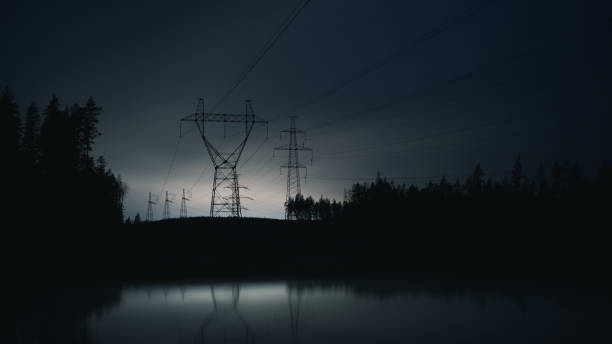 High voltage power line at night stock photo