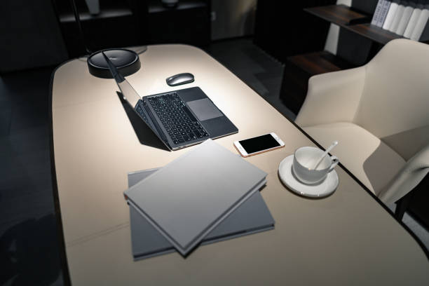 A high-angle view of a portion of a desk in an office stock photo