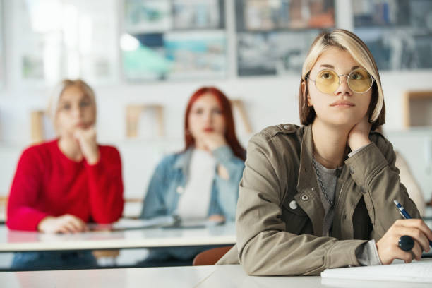 Highschool students in a class. stock photo