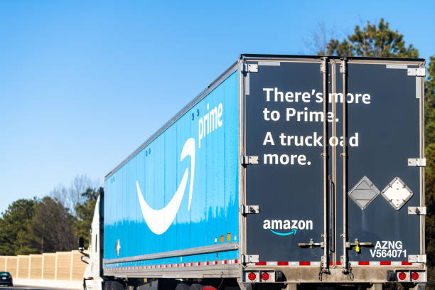 Highway road in Virginia with Amazon prime shipping delivery truck vehicle with blue Prime logo stock photo