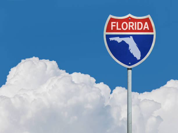 Highway sign for Interstate road in Florida with map in front of clouds Highway sign for Interstate road in Florida with map in front of clouds florida us state photos stock pictures, royalty-free photos & images