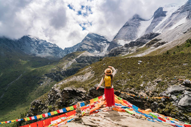 Hike at the national park A female traveller was in the canyon,Daocheng County, Sichuan province, China. tibet stock pictures, royalty-free photos & images