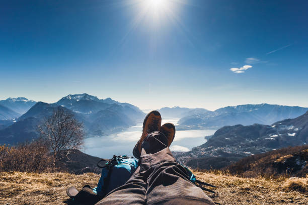 Hiker Relaxing Over Mountain stock photo