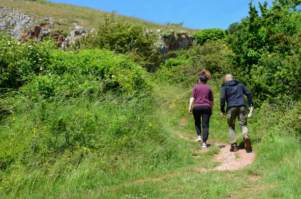 Hikers climb the Little Orme stock photo