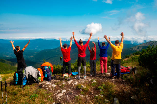 Hikers with open arms stock photo
