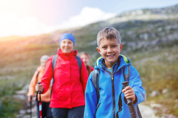 Hiking boy in the mountains stock photo