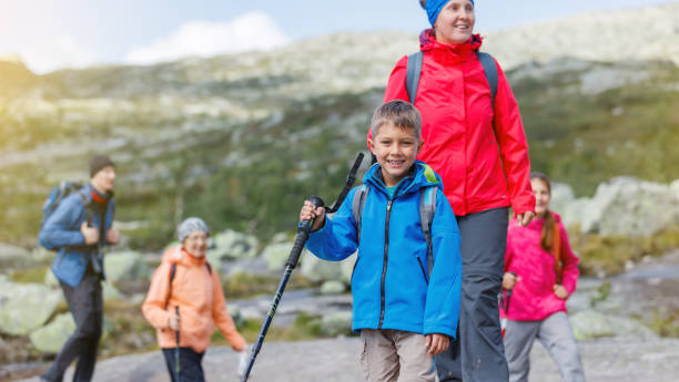 Hiking family in the mountains stock photo
