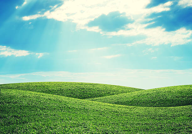 Hills and sky Green hills under bright sky. Nature concept grass area stock pictures, royalty-free photos & images