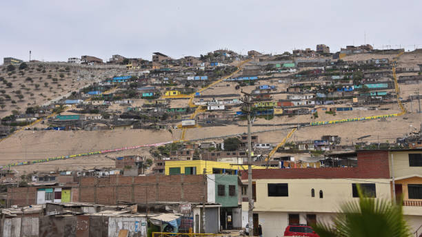 Hillside slum buildings on the outskirts of Lima, Peru stock photo