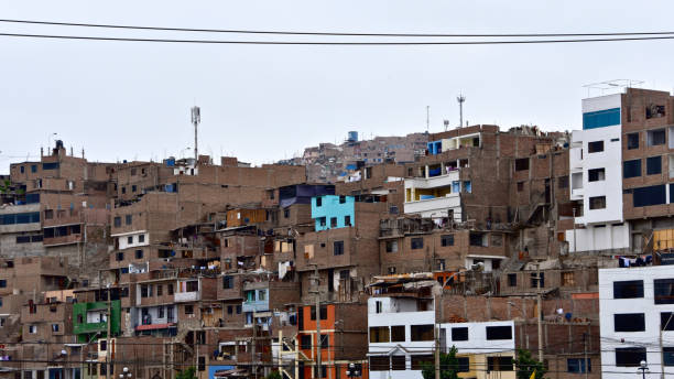 Hillside slum buildings on the outskirts of Lima, Peru stock photo