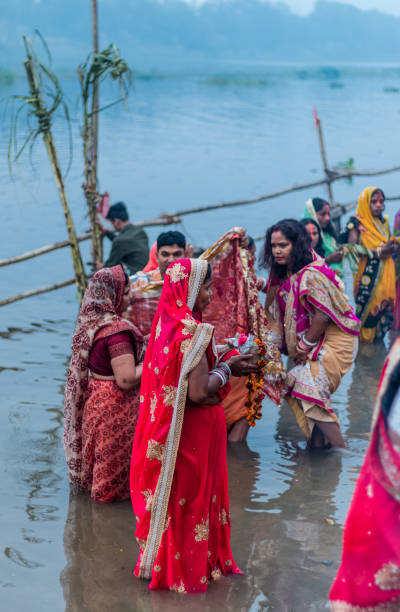 Hindu Devotees Celebrate Chhath Puja Festival Ghaziabad, Uttar Pradesh/India - Nov 2019 : People gather to worship the Sun god at Hindon River during the festival of Chhath Puja chhath stock pictures, royalty-free photos & images