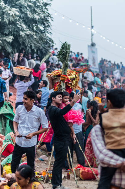Hindu Devotees Celebrate Chhath Puja Festival Ghaziabad, Uttar Pradesh/India - Nov 2019 : Devotees carrying fruits and other stuff on their head to celebrate the festival of Chhath Puja at Hindon river chhath stock pictures, royalty-free photos & images