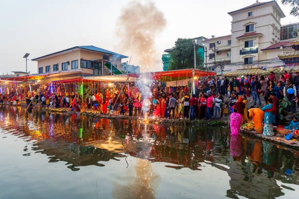 Hindu Devotees Celebrating Chhath Puja Festival Kathmandu,Nepal - November 1,2019: Hindu devotees Celebrating Chhath Puja Festival at Kamal pokhari, Kathmandu. Chath Puja Celebration chhath stock pictures, royalty-free photos & images