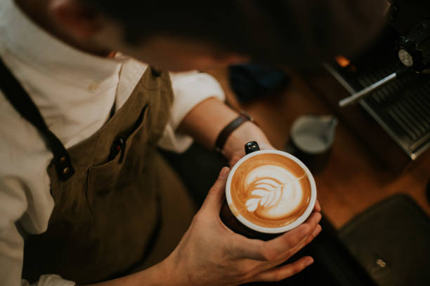 Hipster Barista men make coffee cup latte art stock photo stock photo