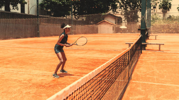A Hispanic girl is playing tennis stock photo