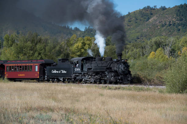 Historic Cumbres Toltec narrow-gauge steam train traveling north to the Antonito, Colorado train station stock photo